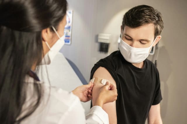 a doctor bandage a patient